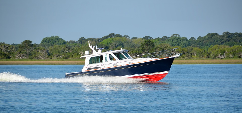 A motor cruiser on a sunny day with RYA Day Skipper students aboard.