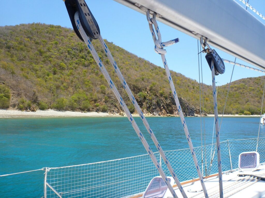 A yacht anchored off of a beautiful tropical island.