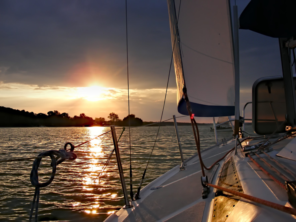 If you are taking your RYA day skipper sail, you will likely need to conserve electricity as shown by this sailing yacht sailing into the sunset.