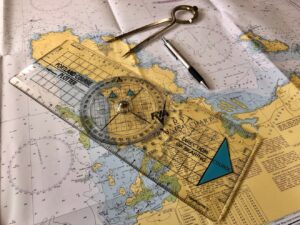 A photo showing the kind of navigation tools and charts used by graduates of the Day Skipper Course.